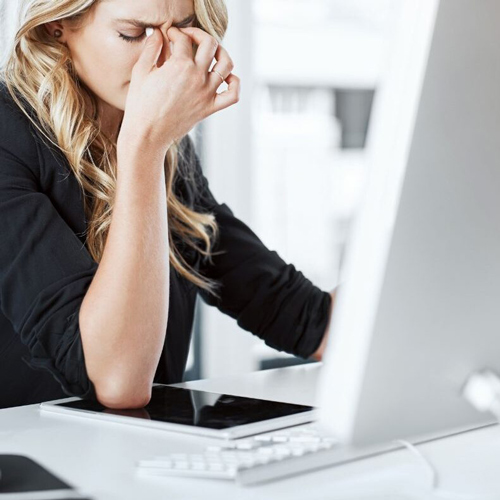 woman at a computer under stress
